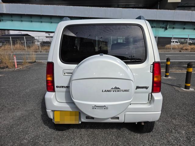 ジムニー ランドベンチャー　４ＷＤ　キーレスエントリー　電動格納ミラー　シートヒーター　オートマ　ＡＢＳ　アルミホイール　衝突安全ボディ　エアコン　パワーウィンドウ　運転席エアバッグ　パールホワイト（2枚目）