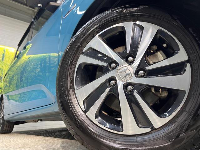 フリードハイブリッド ハイブリッド・ＥＸ　純正９型ナビ　ホンダセンシング　バックカメラ　後席モニター　レーダークルーズコントロール　両側パワースライドドア　シートヒーター　禁煙車　ＬＥＤヘッドランプ　純正１５インチアルミ（12枚目）