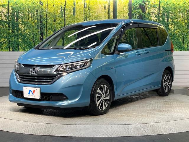 フリードハイブリッド ハイブリッド・ＥＸ　純正９型ナビ　ホンダセンシング　バックカメラ　後席モニター　レーダークルーズコントロール　両側パワースライドドア　シートヒーター　禁煙車　ＬＥＤヘッドランプ　純正１５インチアルミ（21枚目）