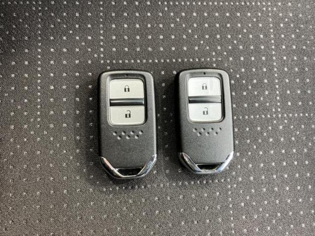 フィットハイブリッド ハイブリッド　新品タイヤ／保証書／ＥＴＣ／ＥＢＤ付ＡＢＳ／横滑り防止装置／アイドリングストップ／パワーウインドウ／エンジンスタートボタン／オートエアコン／パワーステアリング／盗難防止システム／ＵＶカットガラス（29枚目）