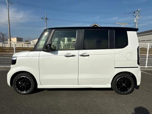 N-BOXカスタム ターボコーディネートスタイル2トーン 純正 9インチ ナビ/ホンダセンシング/両側電動スライドドア/シートヒーター 前席/マルチビューカメラシステム/車線逸脱防止支援システム/シート 合皮/届出済未使用車/ヘッドランプ LED 禁煙車(2枚目)