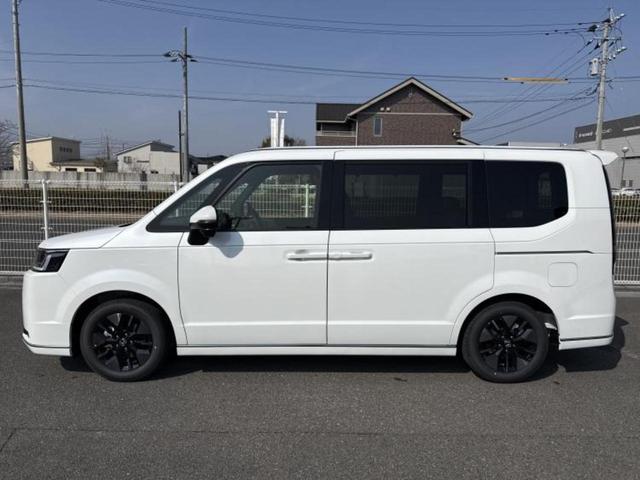 ステップワゴン eHEVスパーダ 純正 11インチ ナビ/フリップダウンモニター 純正 15.6インチ/ホンダセンシング/両側電動スライドドア/シートヒーター 前席/車線逸脱防止支援システム/電動バックドア/登録済未使用車 禁煙車(2枚目)