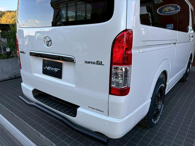 ハイエースバン スーパーＧＬ　ダークプライムＩＩ　新車未登録　８型　ダークプライムＩＩ　ナビＴＶ　全方位カメラ　トヨタセーフティセンス　両側電動スライドドア　黒木目コンビステアリング　ＪＡＯＳ前後スキッドバー　ナイトロパワー艶消黒１６ＡＷ（61枚目）