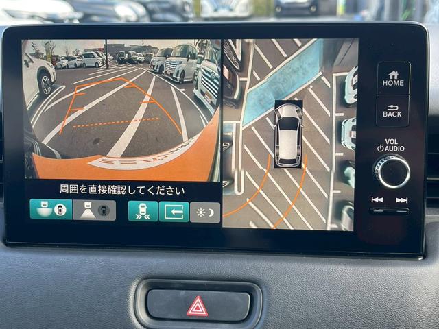 ヴェゼル ｅ：ＨＥＶ　Ｚ　禁煙車　ＢＳＭ　障害物センサー　全周囲カメラ　フルセグＴＶ　純正９インチナビ　シートヒーター　前後ドラレコ　ＥＴＣ　スマートキー　ハーフレザーシート　電動リアゲート　フロントフォグランプ　純正アルミ（6枚目）