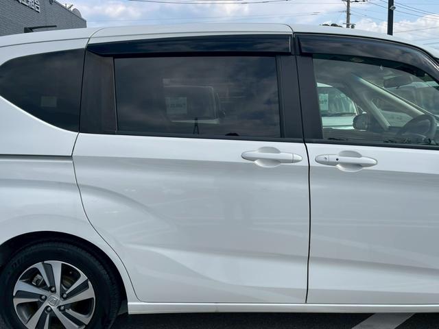 フリードハイブリッド ハイブリッド・Ｇホンダセンシング　禁煙　純正９インチナビ　　前後ドラレコ　フルセグＴＶ　レーダークルーズコントロール　　バックカメラ　ＥＴＣクリアランスソナー　　スマートキー　３列シート　両側電動スライドドア　ワンオーナ－（10枚目）