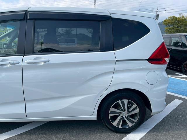 フリードハイブリッド ハイブリッド・Ｇホンダセンシング　禁煙　純正９インチナビ　　前後ドラレコ　フルセグＴＶ　レーダークルーズコントロール　　バックカメラ　ＥＴＣクリアランスソナー　　スマートキー　３列シート　両側電動スライドドア　ワンオーナ－（19枚目）