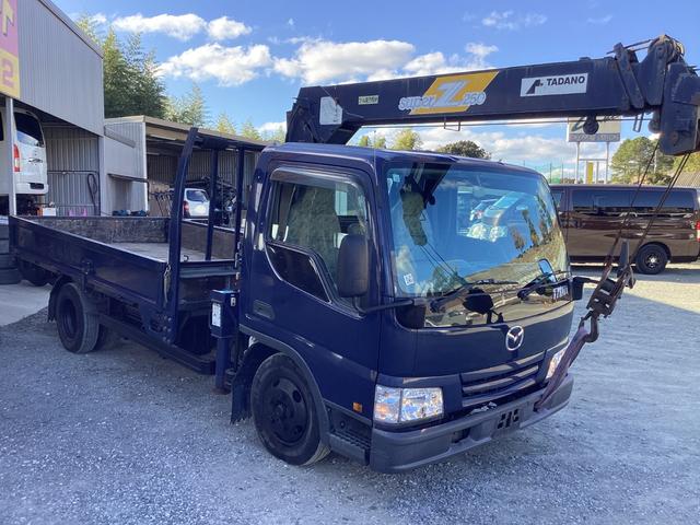 タイタントラック ロングワイドロー　平ボディー　クレーン付き　三方開　最積２ｔ　ダブルタイヤ　５速ミッション　パワーステアリング　エアバック（7枚目）