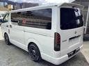 ハイエースバン スーパーGL ダークプライム 4型後期 両側パワースライドドア 社外アルミホイール 社外フロントスポイラー 社外テールランプ 荷室コンパネ施工 リアコーナーセンサー 純正LEDヘッドライト プッシュスタート 100V電源 中古車画像_3