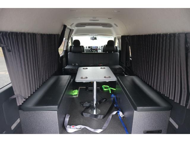 ハイエースワゴン グランドキャビン　モデリスタウインチ　荷台仮装済み　ベット　対面シート　　テーブル　１０人乗り　車いす登録　車いすラダー床下収納（26枚目）