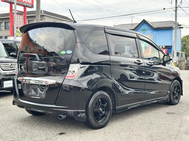 フリードハイブリッド ジャストセレクション　９インチナビ　フルセグ　ＤＶＤ　ＣＤ　バックカメラ　パワースライドドア　社外１５インチアルミ　ＨＩＤヘッドライト　スマートキー　ドラレコ　ＥＴＣ（10枚目）