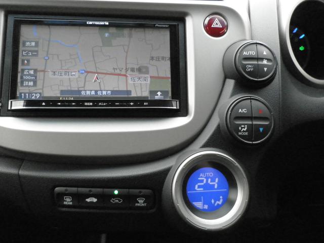 フィットハイブリッド スマートセレクション　バックカメラ　ナビ　ＴＶ　Ｂｌｕｅｔｏｏｔｈ接続　ＣＤ　ＤＶＤ　社外アルミホイール　オートライト　スマートキー　キーレスエントリー　電動格納ミラー　衝突安全ボディ　盗難防止システム（19枚目）