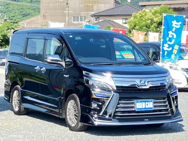 ヴォクシー ハイブリッドＺＳ　煌　トヨタセーフティセンス　モデリスタエアロ　純正１０インチＳＤナビ　フルセグ　ブルートゥース　バックカメラ　ＨＤＭＩ接続可能　純正１２インチ後席モニター　両側電動スライドドア　オートクルーズ　ＥＴＣ（3枚目）