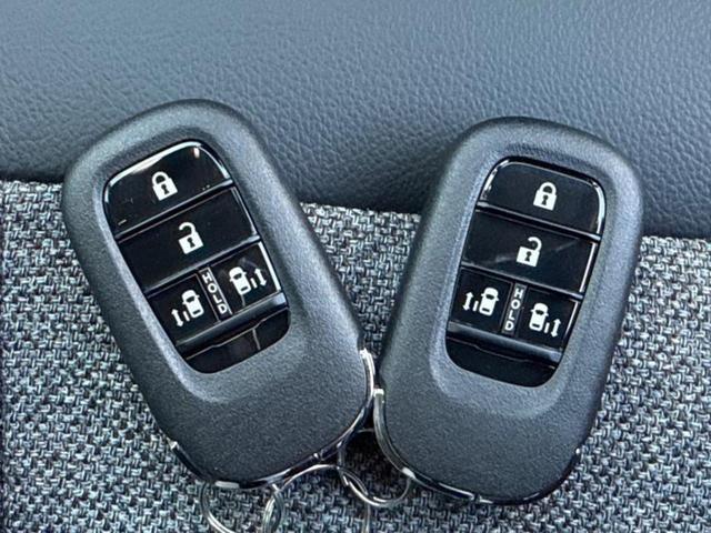 フリード ｅＨＥＶエアーＥＸ　新品タイヤ／純正　９インチ　メモリーナビ／ホンダセンシング／両側電動スライドドア／シートヒーター　前席／車線逸脱防止支援システム／パーキングアシスト　バックガイド／ヘッドランプ　ＬＥＤ　バックカメラ（34枚目）