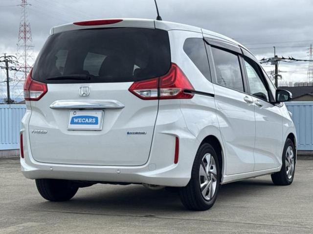 フリードハイブリッド ハイブリッドＧ　新品タイヤ／保証書／純正　１０インチ　ＳＤナビ／ホンダセンシング／両側電動スライドドア／シートヒーター　前席／車線逸脱防止支援システム／ドライブレコーダー　純正／ヘッドランプ　ＬＥＤ　バックカメラ（3枚目）