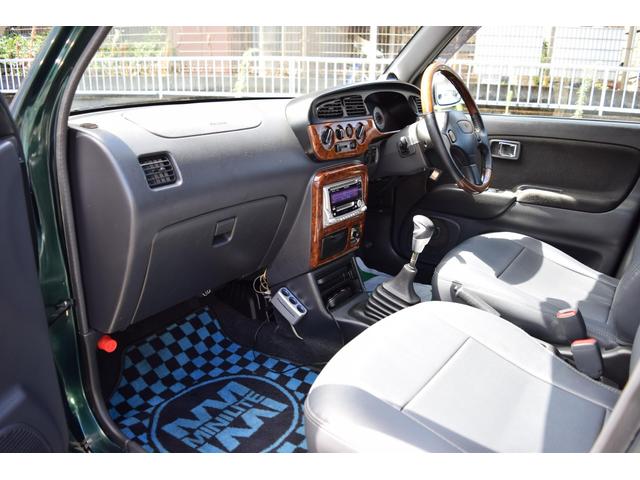 ミラジーノ ミニライトスペシャルターボ　５速ＭＴ・インタークーラーターボ・ターボタイマー付エンジンスターター・社外ブーストメーター・純正ミニライト１４インチＡＷ・ウッドコンビハンドル・シートカバー・リア修復有り（18枚目）