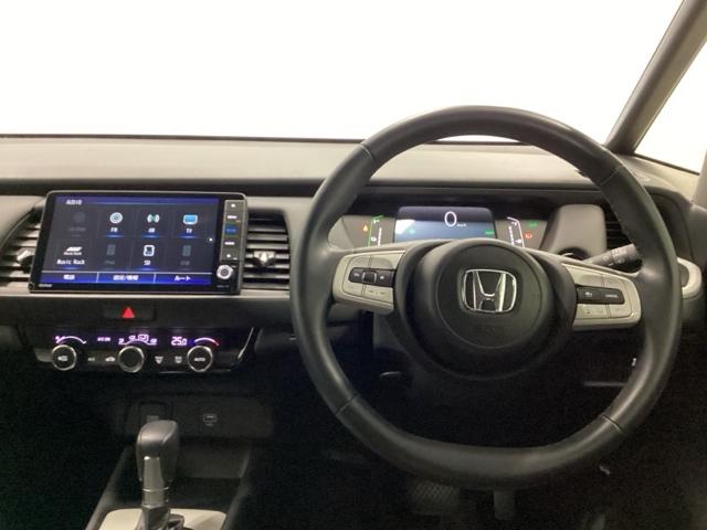 フィット e:HEVホーム メモリーナビ ETC リアカメラ 前後誤発進抑制機能 クリソナ 助手席エアバッグ 運転席エアバッグ アイドリングストップ LEDライト USB接続 バックカメラ ABS サイドエアバッグ フルセグTV(3枚目)