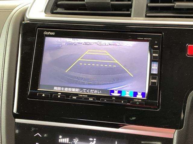 フィットハイブリッド Ｆパッケージ　純正ナビ　フルセグ　リアカメラ　地デジＴＶ　盗難警報装置　ＡＵＴＯエアコン　助手席エアバック　ＥＣＯＮ　ＥＴＣ付き　リヤカメラ　ＵＳＢ　ＡＢＳ付　ＤＶＤ視聴　横滑り防止システム　キーレスエントリー（12枚目）