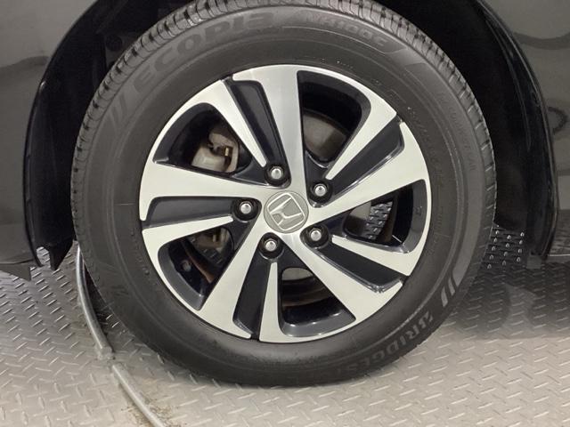 フリード Ｇ・ホンダセンシング　純正メモリーナビ　両側電動スライドドア　スマートキーＰスタート　盗難防止システム　横滑防止装置　ＬＥＤランプ　ナビＴＶ　記録簿　リアカメ　クルコン　パワーウインド　ウォークスルー　ＤＶＤ再生機能（21枚目）