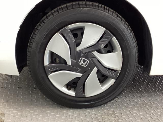 フィットハイブリッド Fパッケージ メモリーナビ オートエアコン ETC イモビライザー スマキー 運転席助手席エアバッグ ナビTV ECONモード 横滑り防止機能 キーレス 運転席エアバッグ USB ABS DVD視聴 ワンセグ(21枚目)