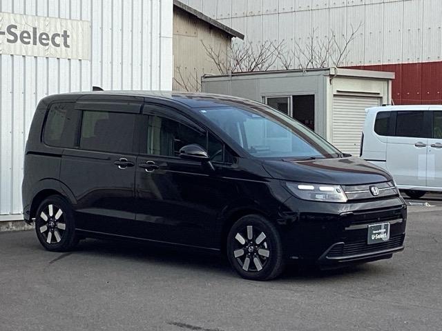 フリード ｅ：ＨＥＶエアーＥＸ　ＥＴＣ／純正ナビ／バックモニター／ホンダセンシング／全周囲カメラ　セキュリティアラーム　両側電動パワースライドドア　横滑り防止　エアコン　ＤＶＤ再生可　クルコン　誤発進抑制機能　ナビ＆ＴＶ　三列シート（7枚目）