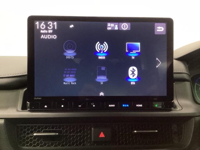 ステップワゴン e:HEVスパーダ 禁煙車 メモリーナビ リアカメラ 両側電動スライドドア 地デジチューナー 前後障害物センサー 両側オートスライドドア 前後誤発進抑制 VSA サイドエアバッグ DVD再生 パワーウィンドウ 3列シート(10枚目)