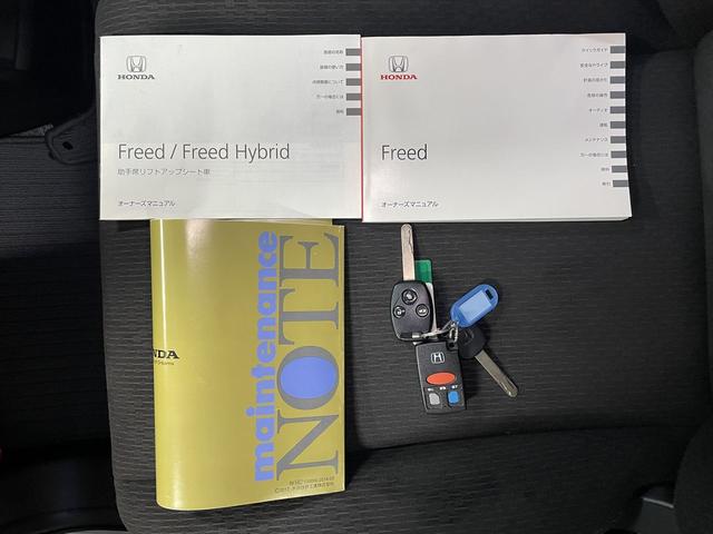 フリード 　１．５Ｇ　福祉車両・助手席リフトＵＰシート・６人乗・走行１６千Ｋ・左電動スライドドア・ＣＤオーディオ・左右スライドドア・キーレス・リモコン・折り畳み車イス固定ネット・左右ＳＤ・純正ＨＩＤヘッドライト（34枚目）