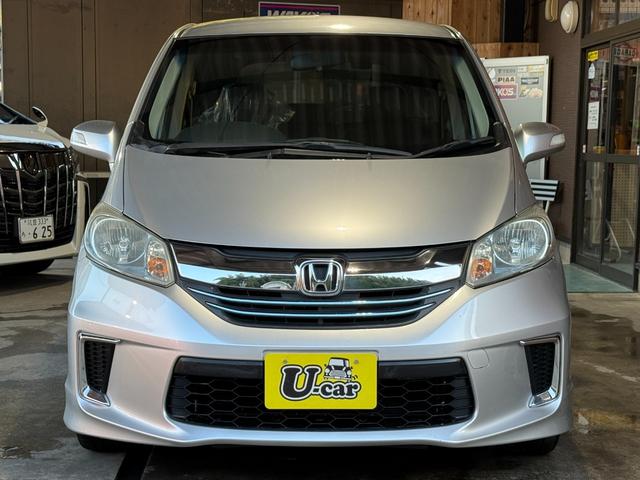 フリードハイブリッド ハイブリッド　プレミアムエディション　両側電動スライドドア／純正ナビ／ＣＤ／ＤＶＤ／ＢＬＵＥＴＯＯＴＨ／バックカメラ／後席フリップダウンモニター／ＥＴＣ／コーティング施工／禁煙車（3枚目）