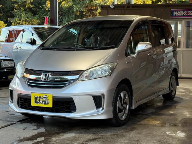 フリードハイブリッド ハイブリッド　プレミアムエディション　両側電動スライドドア／純正ナビ／ＣＤ／ＤＶＤ／ＢＬＵＥＴＯＯＴＨ／バックカメラ／後席フリップダウンモニター／ＥＴＣ／コーティング施工／禁煙車（4枚目）