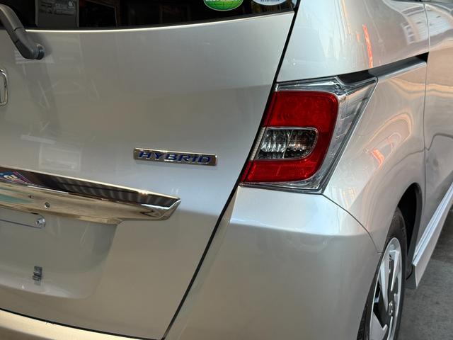 フリードハイブリッド ハイブリッド　プレミアムエディション　両側電動スライドドア／純正ナビ／ＣＤ／ＤＶＤ／ＢＬＵＥＴＯＯＴＨ／バックカメラ／後席フリップダウンモニター／ＥＴＣ／コーティング施工／禁煙車（13枚目）