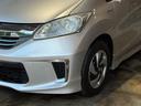 フリードハイブリッド ハイブリッド　プレミアムエディション　両側電動スライドドア／純正ナビ／ＣＤ／ＤＶＤ／ＢＬＵＥＴＯＯＴＨ／バックカメラ／後席フリップダウンモニター／ＥＴＣ／コーティング施工／禁煙車（5枚目）