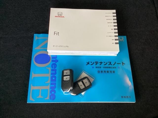 フィット １３Ｇ・Ｆパッケージコンフォートエディション　純正メモリナビ　衝突低減ブレーキ　ＥＴＣ　シティブレーキアクティブシステム　パワーウィンドウ　横滑り防止機能　キーレス　シートヒータ　インテリキー　地デジＴＶ　ＡＡＣ　ＴＶナビ　Ｉストップ　ＤＶＤ再生（19枚目）
