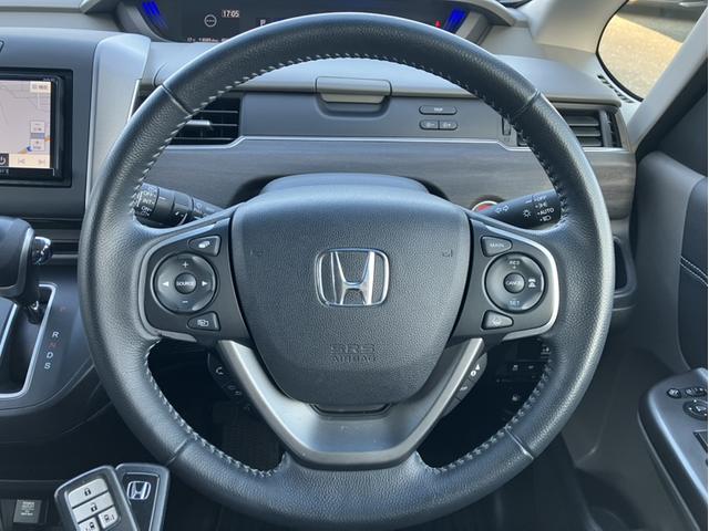 フリード Ｇ・ホンダセンシング　Ｓパケ／Ｃパケ／７人乗り／社外７型ナビ／前方ドラレコ／Ｂカメラ／半革シート／１５インチアルミ／１オーナー車　フルセグ地デジ　点検記録簿　追従走行　電動ミラー　サイドエアバッグ　ワンオーナー車　ＬＫＡ（21枚目）