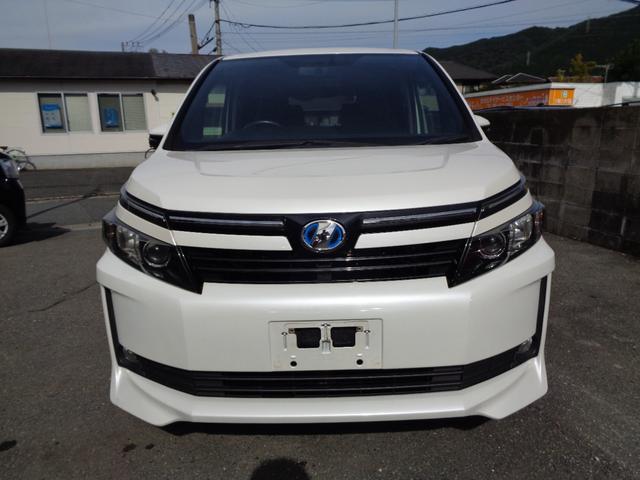 ヴォクシー ハイブリッドV 禁煙車 プッシュスタート スマートキー 後席モニター 両側電動ドア 純正9型ナビ フルセグTV DVD再 Bluetooth Bカメラ ETC 純正シートカバー LEDヘッドランプ 前席シートヒーター(2枚目)