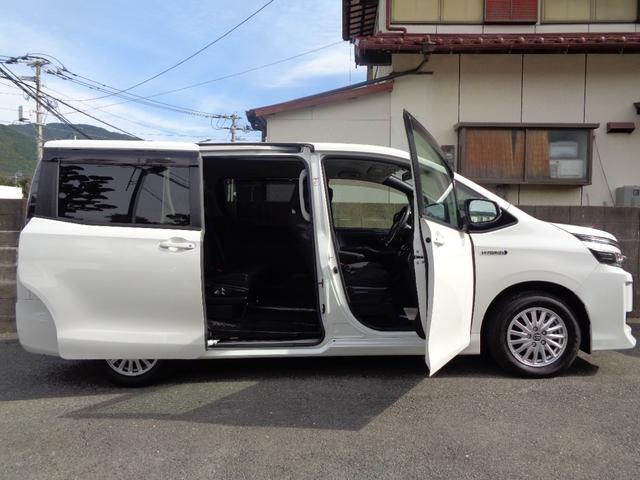 ヴォクシー ハイブリッドV 禁煙車 プッシュスタート スマートキー 後席モニター 両側電動ドア 純正9型ナビ フルセグTV DVD再 Bluetooth Bカメラ ETC 純正シートカバー LEDヘッドランプ 前席シートヒーター(9枚目)