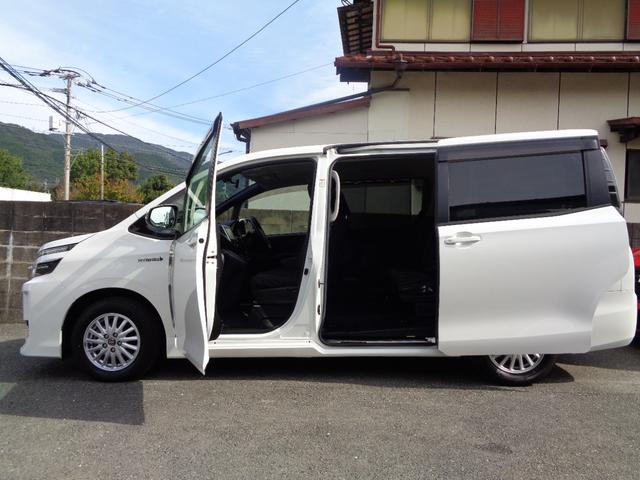 ヴォクシー ハイブリッドV 禁煙車 プッシュスタート スマートキー 後席モニター 両側電動ドア 純正9型ナビ フルセグTV DVD再 Bluetooth Bカメラ ETC 純正シートカバー LEDヘッドランプ 前席シートヒーター(11枚目)