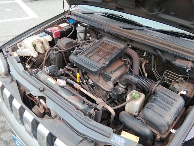 ジムニー ランドベンチャー　４ＷＤ切替　リフトアップ　ＨＤＤナビ　ワンセグＴＶ　ＣＤ／ＤＶＤ再生　社外１６インチＡＷ　フォグランプ　ハードカバー付き背面タイヤ　ハーフレザーシート　電動格納ミラー　ライトレベライザー　エアコン（5枚目）