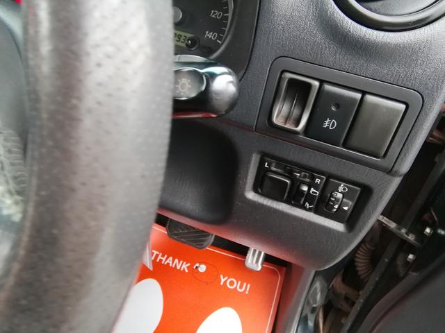 ジムニー ランドベンチャー　４ＷＤ切替　リフトアップ　ＨＤＤナビ　ワンセグＴＶ　ＣＤ／ＤＶＤ再生　社外１６インチＡＷ　フォグランプ　ハードカバー付き背面タイヤ　ハーフレザーシート　電動格納ミラー　ライトレベライザー　エアコン（11枚目）