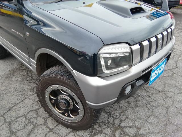 ジムニー ランドベンチャー　４ＷＤ切替　リフトアップ　ＨＤＤナビ　ワンセグＴＶ　ＣＤ／ＤＶＤ再生　社外１６インチＡＷ　フォグランプ　ハードカバー付き背面タイヤ　ハーフレザーシート　電動格納ミラー　ライトレベライザー　エアコン（16枚目）