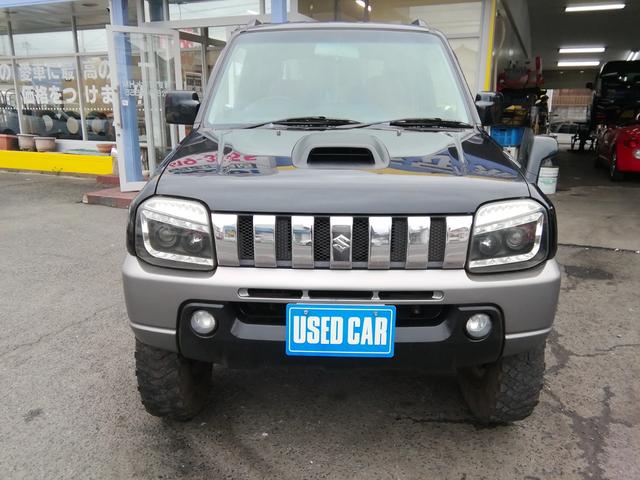 ジムニー ランドベンチャー　４ＷＤ切替　リフトアップ　ＨＤＤナビ　ワンセグＴＶ　ＣＤ／ＤＶＤ再生　社外１６インチＡＷ　フォグランプ　ハードカバー付き背面タイヤ　ハーフレザーシート　電動格納ミラー　ライトレベライザー　エアコン（25枚目）