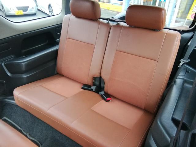 ジムニー ランドベンチャー　４ＷＤ切替　リフトアップ　ＨＤＤナビ　ワンセグＴＶ　ＣＤ／ＤＶＤ再生　社外１６インチＡＷ　フォグランプ　ハードカバー付き背面タイヤ　ハーフレザーシート　電動格納ミラー　ライトレベライザー　エアコン（28枚目）