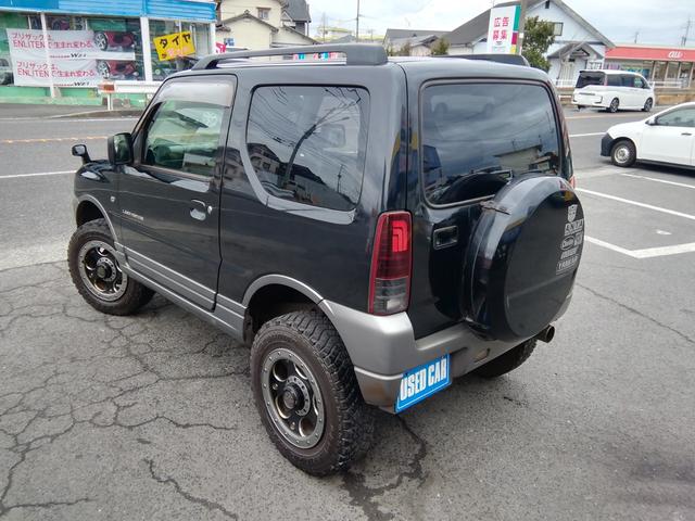 ジムニー ランドベンチャー　４ＷＤ切替　リフトアップ　ＨＤＤナビ　ワンセグＴＶ　ＣＤ／ＤＶＤ再生　社外１６インチＡＷ　フォグランプ　ハードカバー付き背面タイヤ　ハーフレザーシート　電動格納ミラー　ライトレベライザー　エアコン（30枚目）