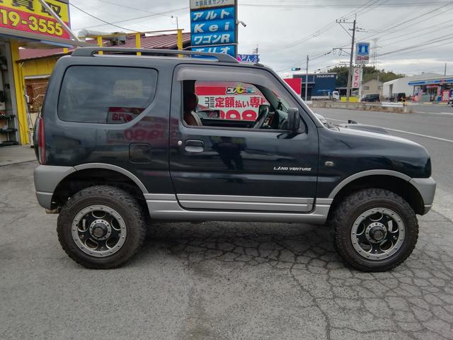 ジムニー ランドベンチャー　４ＷＤ切替　リフトアップ　ＨＤＤナビ　ワンセグＴＶ　ＣＤ／ＤＶＤ再生　社外１６インチＡＷ　フォグランプ　ハードカバー付き背面タイヤ　ハーフレザーシート　電動格納ミラー　ライトレベライザー　エアコン（33枚目）