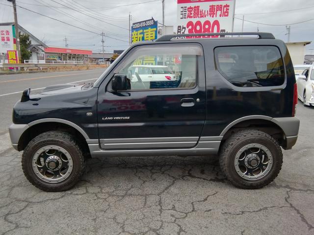 ジムニー ランドベンチャー　４ＷＤ切替　リフトアップ　ＨＤＤナビ　ワンセグＴＶ　ＣＤ／ＤＶＤ再生　社外１６インチＡＷ　フォグランプ　ハードカバー付き背面タイヤ　ハーフレザーシート　電動格納ミラー　ライトレベライザー　エアコン（36枚目）