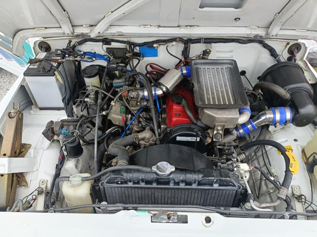 ジムニー EC 5速・社外16インチアルミ・ステアリングダンパー・社外マフラー・タイミングベルト交換済/R3年54630km・サクションホース・IPFオフロードランプ・※純正白から純正白全塗装※(46枚目)