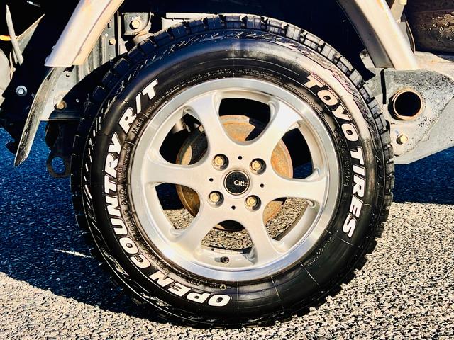 サンバートラック ＴＣ　リフトアップ・社外１４インチアルミ・ブロックタイヤ・キーレス・（11枚目）