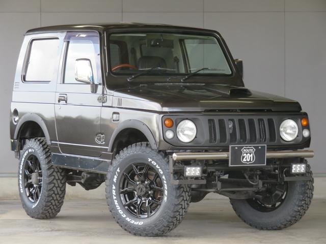 ジムニー ワイルドウインド　ガンＭ全塗装　リフトアップ　新品ＢＡＤＸ　ＤＯＳ＋オープンカントリー２２５／７５／１６　オーバーフェンダー／グリル各部チッピング黒塗装　社外前後バンパー／マフラー／テール／ＬＥＤフォグ／シートカバー（8枚目）