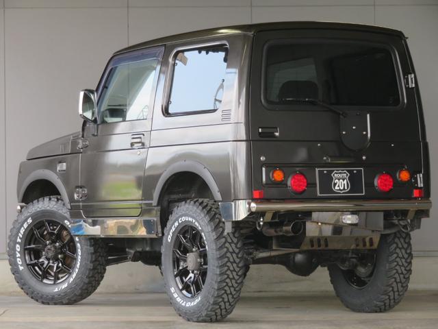 ジムニー ワイルドウインド　ガンＭ全塗装　リフトアップ　新品ＢＡＤＸ　ＤＯＳ＋オープンカントリー２２５／７５／１６　オーバーフェンダー／グリル各部チッピング黒塗装　社外前後バンパー／マフラー／テール／ＬＥＤフォグ／シートカバー（9枚目）