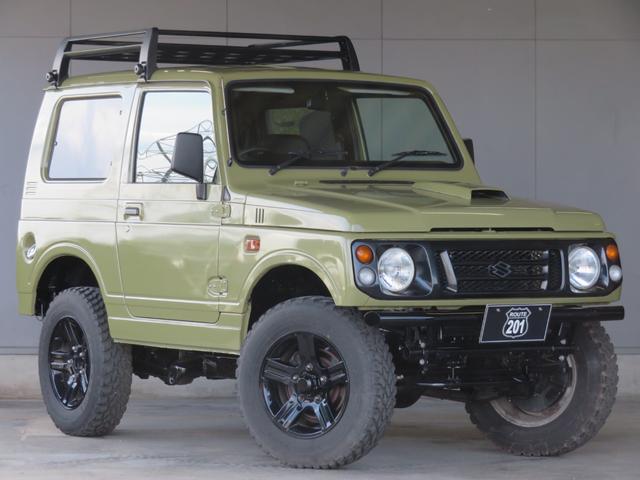 ジムニー ランドベンチャー　ＪＥＥＰ純正コマンドグリーン全塗装　内装塗装　下回り／ホイールブラック塗装　最終型　２インチボディリフトＵＰ　縞板調天張り　カーボン調ハンドル　社外マフラー／前後バンパー／シフトノブ／革調シートカバー（8枚目）