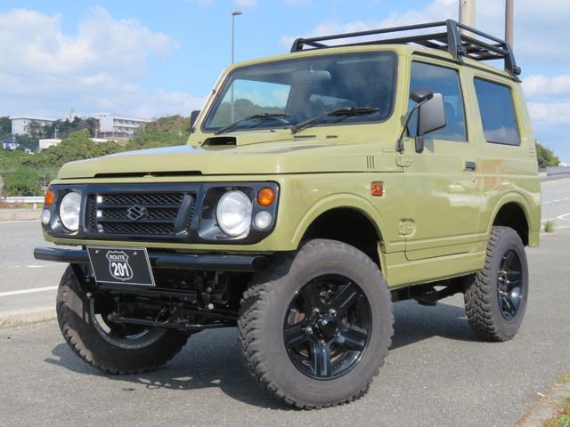 ジムニー ランドベンチャー　ＪＥＥＰ純正コマンドグリーン全塗装　内装塗装　下回り／ホイールブラック塗装　最終型　２インチボディリフトＵＰ　縞板調天張り　カーボン調ハンドル　社外マフラー／前後バンパー／シフトノブ／革調シートカバー（14枚目）