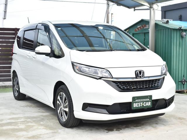 フリードハイブリッド ハイブリッド・Ｇ　ホンダセンシング／両側電動スライドドア／社外ナビ／バックモニター／フルセグＴＶ／Ｂｌｕｅｔｏｏｔｈ／前席シートヒーター／プッシュスタート／車線逸脱防止支援システム／横滑り防止装置／ＥＴＣ（7枚目）